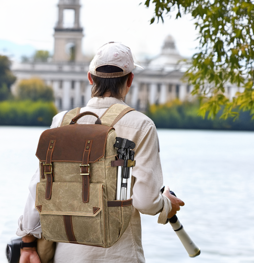 Outdoor shot of a photographer with a stylish camera backpack near a lake, ideal for capturing nature.