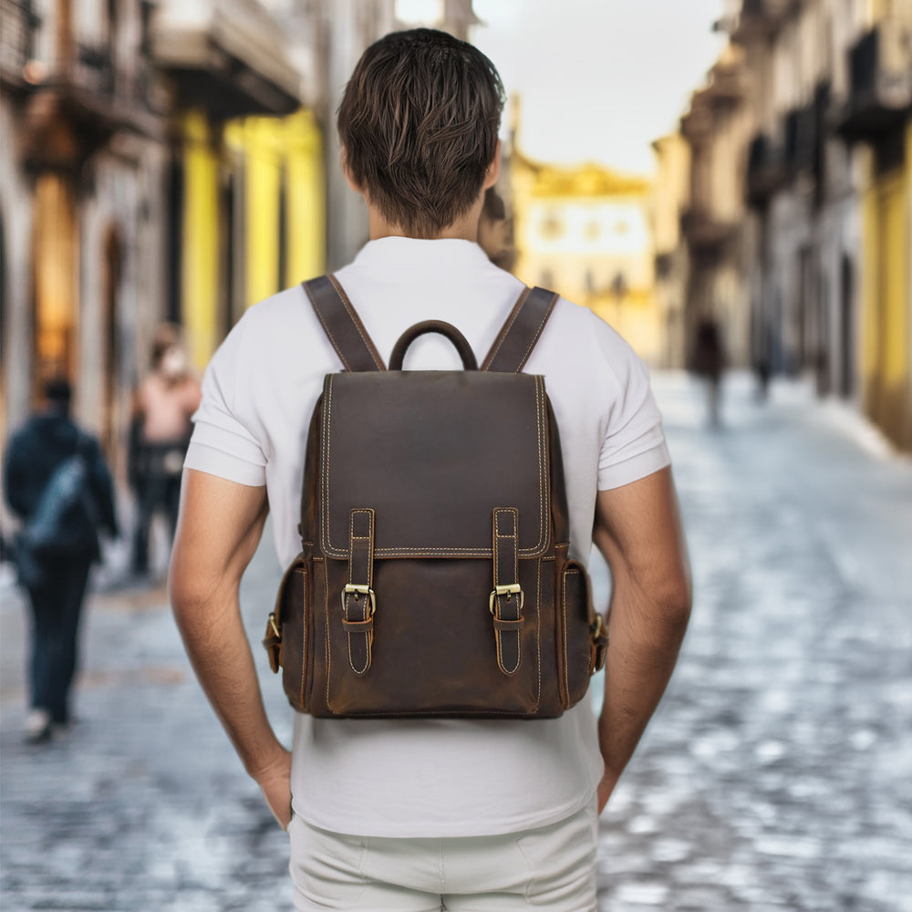 Leather Rucksack by Angel Falls showcased on a man in a city street, highlighting its stylish design and sturdy construction.