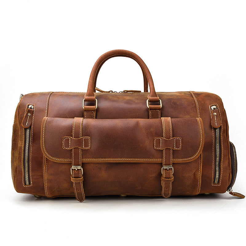 Men's leather weekend bag in rich brown with dual side zippers and sturdy handles for travel and adventure.