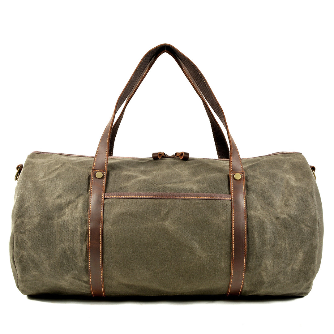 Military duffle bag in olive green canvas with leather accents, ideal for travel and outdoor adventures.