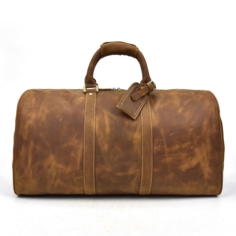 Brown leather holdall bag by Patagonia, featuring a stylish design and sturdy handles for travel and storage.