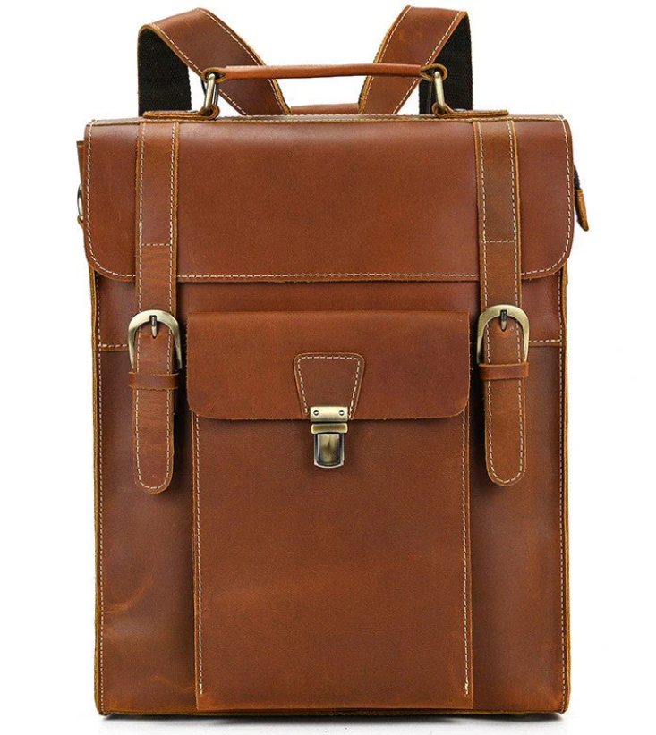 Leather convertible backpack in brown with adjustable straps and front pocket, inspired by the Mediterranean Sea.