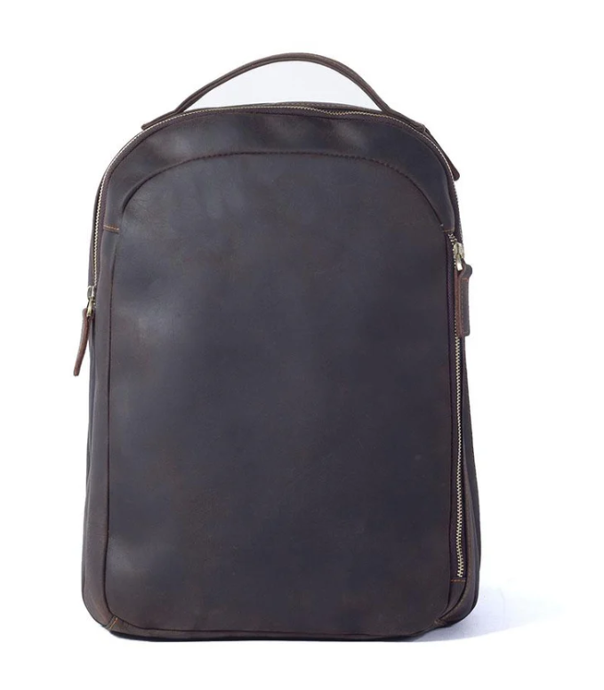 Tan leather rucksack with a sleek design and zipper detailing, ideal for travel and everyday use.