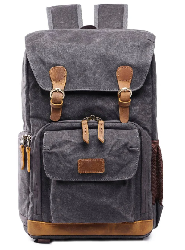 Waterproof canvas camera backpack in dark gray with leather accents, perfect for outdoor photography adventures.