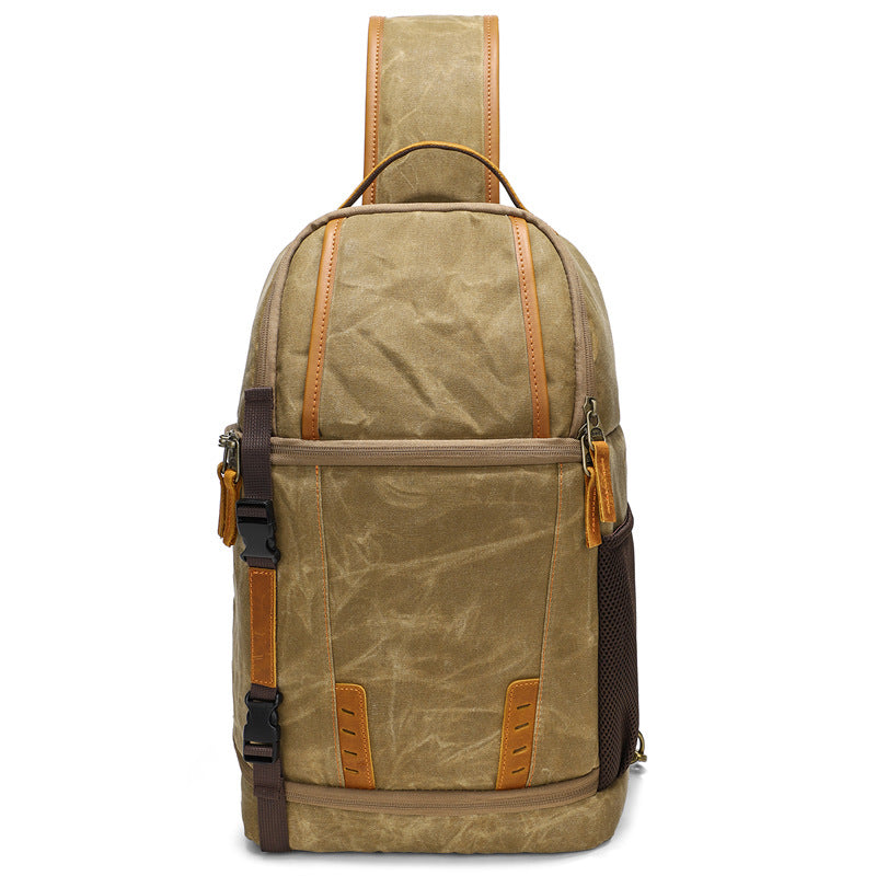 Canvas camera sling bag featuring a rugged design with leather accents, ideal for adventures like Machu Picchu.