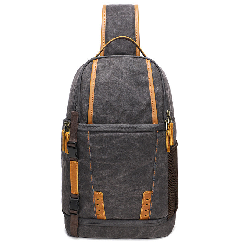 Canvas camera sling bag in gray with tan straps, perfect for photography enthusiasts and travel to Machu Picchu.