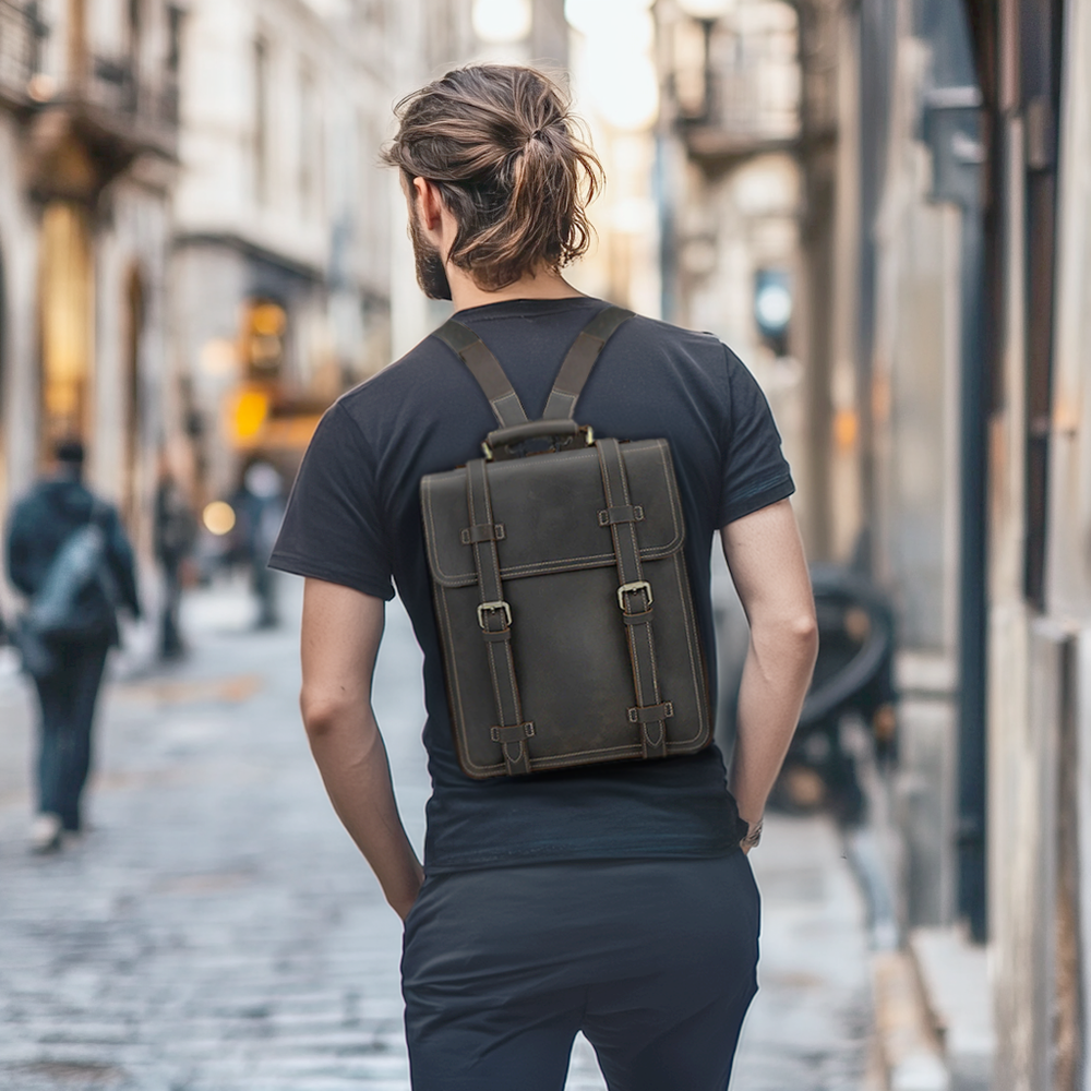 Leather rucksack from Smokies, stylishly worn on a man's back in an urban setting.