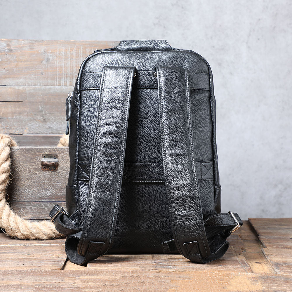 Black leather backpack with adjustable straps, showcasing a stylish and durable design, perfect for everyday use.