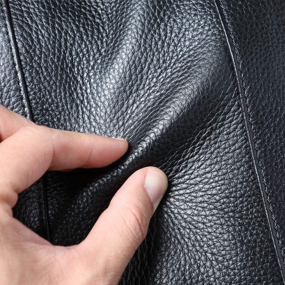 Close-up of textured black leather showcasing its durability in a Black Leather Bookbag.