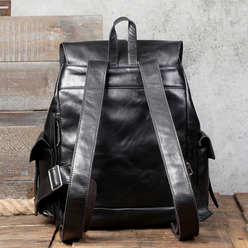 Back view of a small black leather backpack from Lake Victoria, showcasing its durable design and adjustable straps.