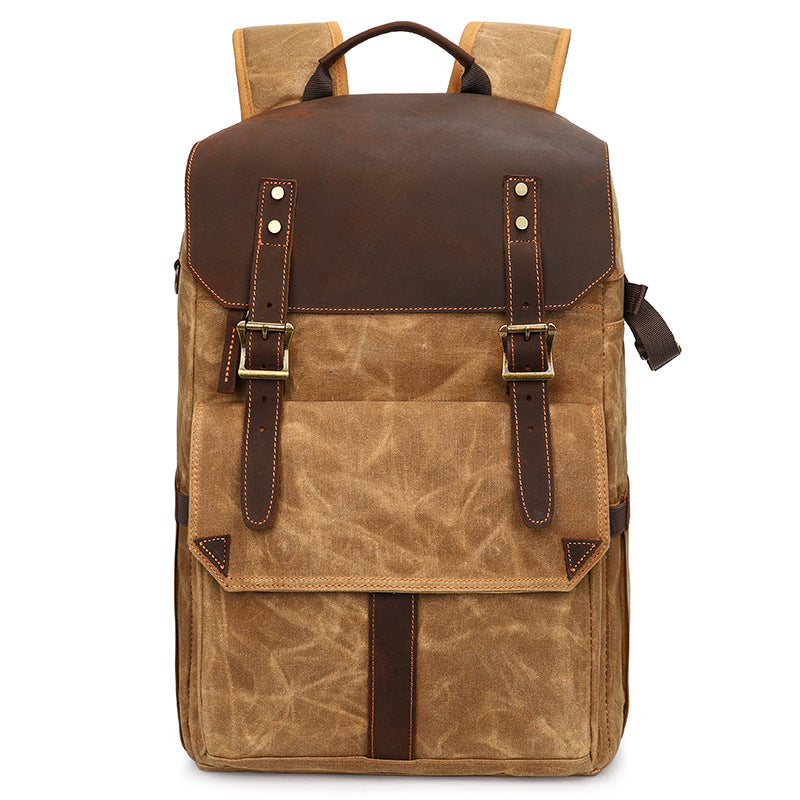 Stylish camera backpack in brown leather and canvas, ideal for photographers and outdoor adventures.