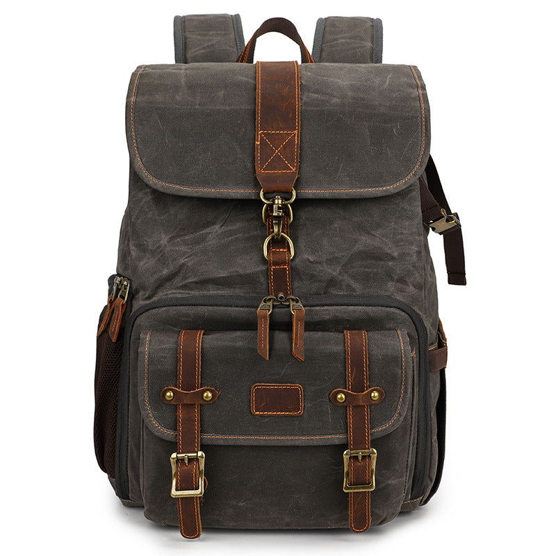 Canvas camera backpack by Kruger, featuring a vintage design with leather accents and multiple compartments.