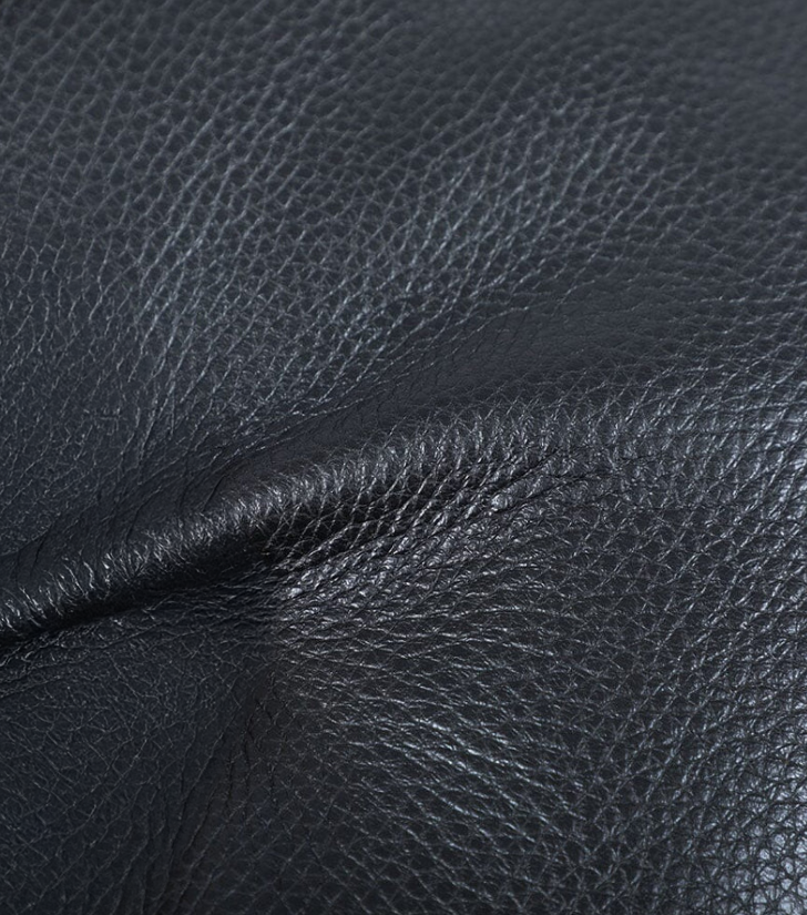 Close-up of black leather texture for the Black Leather Bookbag | Death Valley, showcasing its premium quality.