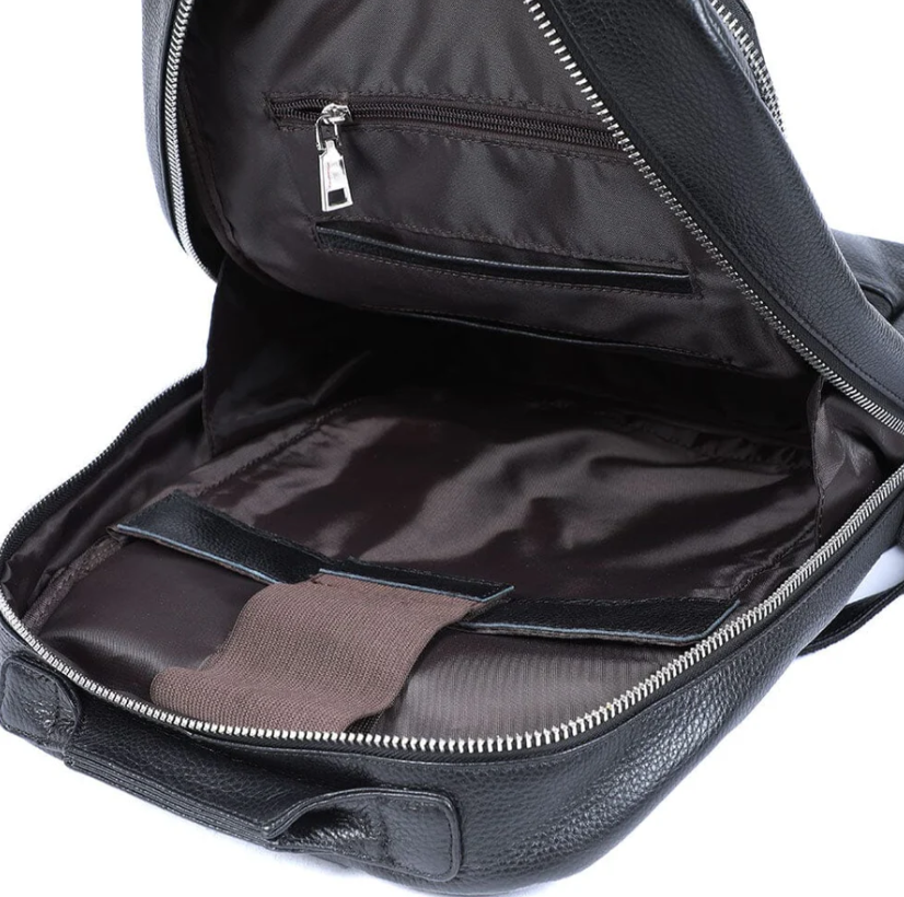 Interior view of a spacious black leather bookbag | Death Valley, featuring pockets and a sleek design.