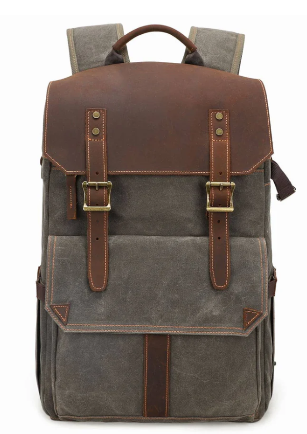 Stylish camera backpack with leather accents and durable canvas, perfect for outdoor photographers.
