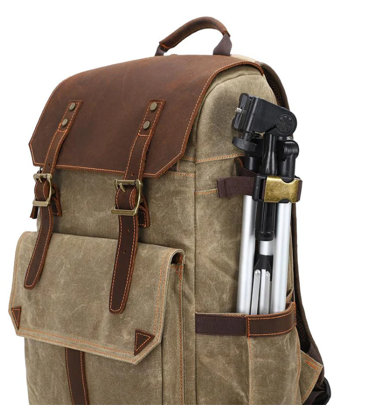 Camera backpack with tripod attachment, featuring durable fabric and leather accents, perfect for outdoor photography.