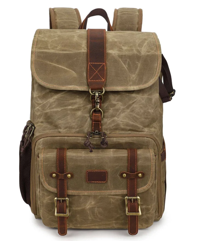 Canvas camera backpack by Kruger with leather accents and multiple compartments for photographers.