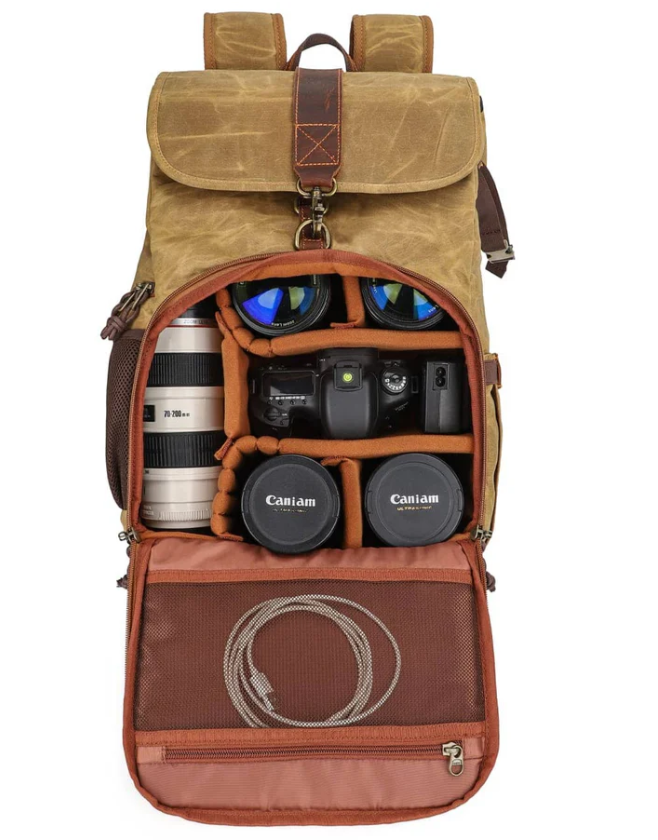Kruger canvas camera backpack with organized compartments for lenses and camera equipment.