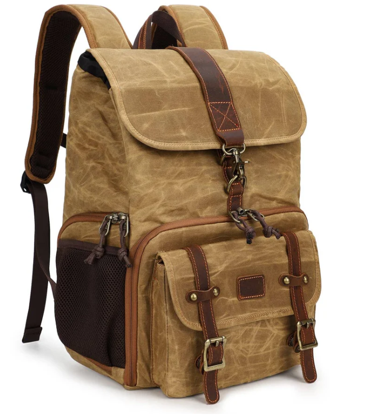 Canvas camera backpack by Kruger, featuring a vintage style with leather straps and multiple pockets for photographers.
