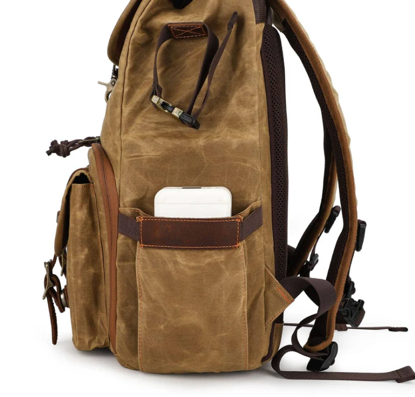 Canvas camera backpack by Kruger featuring a side pocket for easy access to your phone.