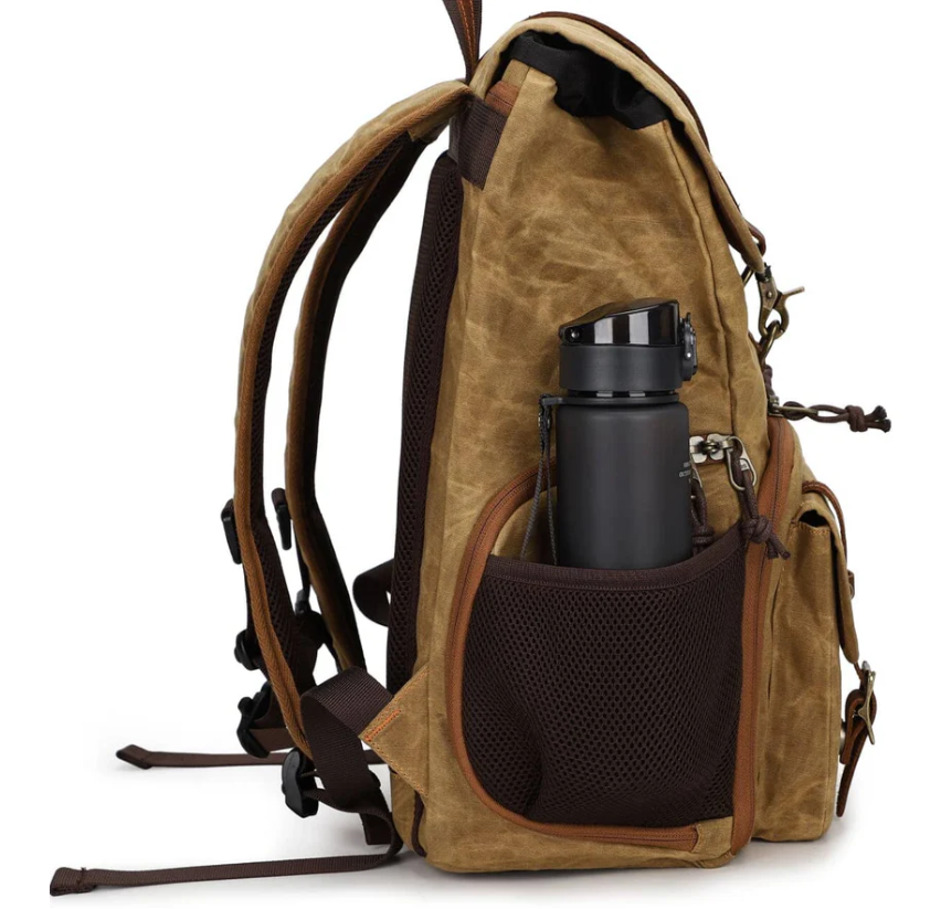 Side view of Kruger canvas camera backpack with water bottle holder, designed for photographers and outdoor enthusiasts.