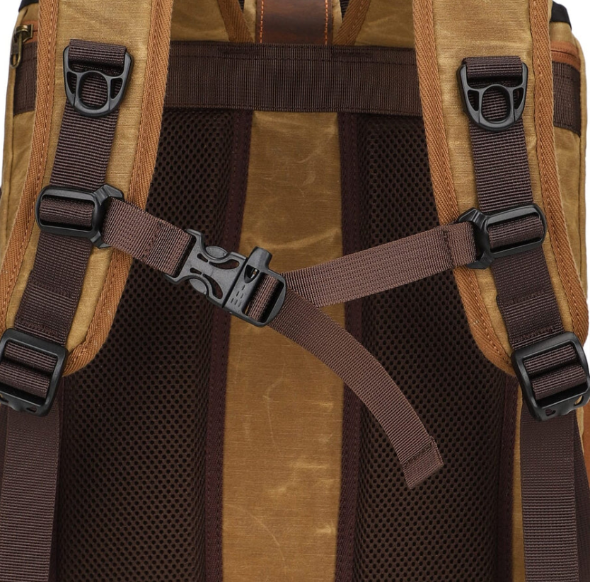 Close-up of the adjustable straps and buckles on the Kruger Canvas Camera Backpack, showcasing its durable design.