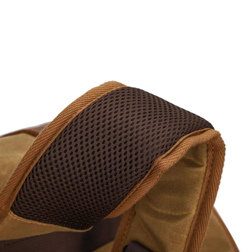 Close-up of the padded shoulder strap of the Canvas Camera Backpack by Kruger, showcasing breathable mesh material.