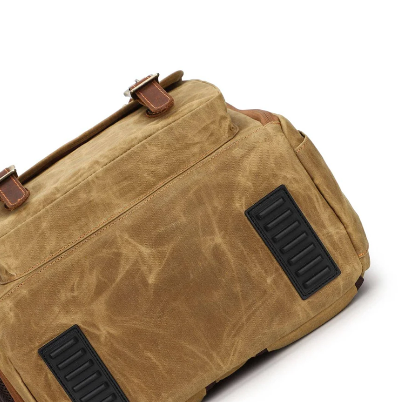 Canvas camera backpack by Kruger, featuring a durable exterior and robust straps for photographers on the go.