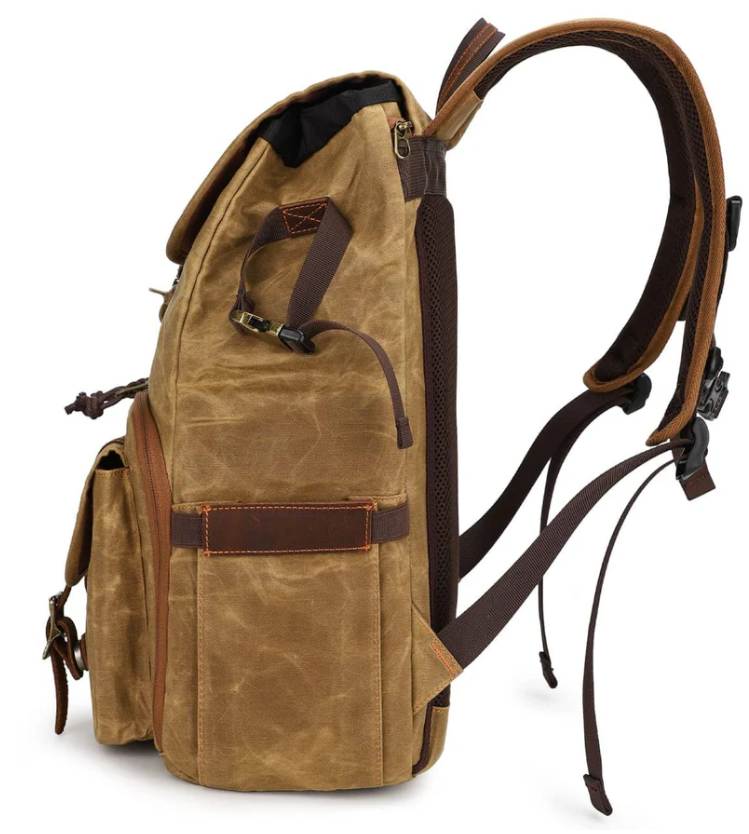 Side view of the Canvas Camera Backpack by Kruger, showcasing its durable material and spacious compartments.