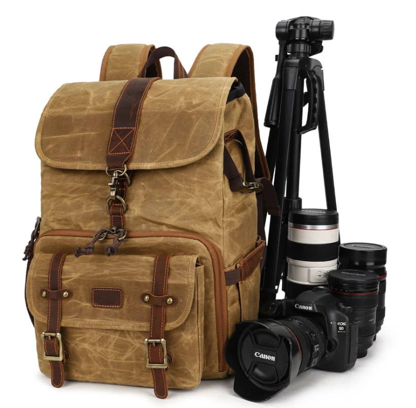 Kruger canvas camera backpack with tripod, designed for photographers to carry gear securely and stylishly.