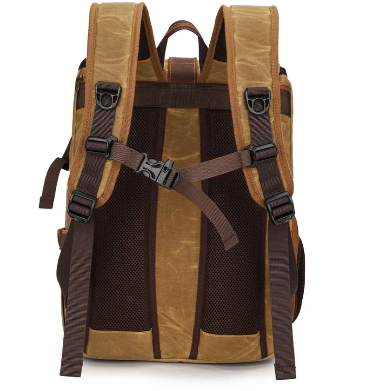 Canvas camera backpack from Kruger showcasing adjustable straps and breathable mesh back for comfort.