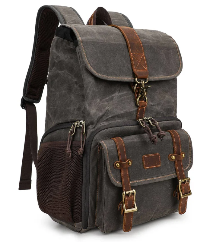 Canvas camera backpack by Kruger, featuring durable material and multiple storage compartments for photographers.
