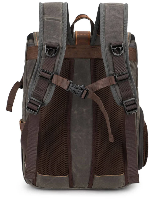 Canvas camera backpack by Kruger with padded straps and mesh back for comfort and style.