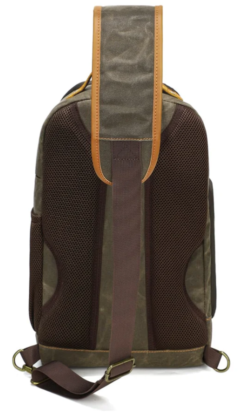 Back view of Canvas Camera Sling Bag with padded mesh for comfort and durability, perfect for outdoor photography adventures.