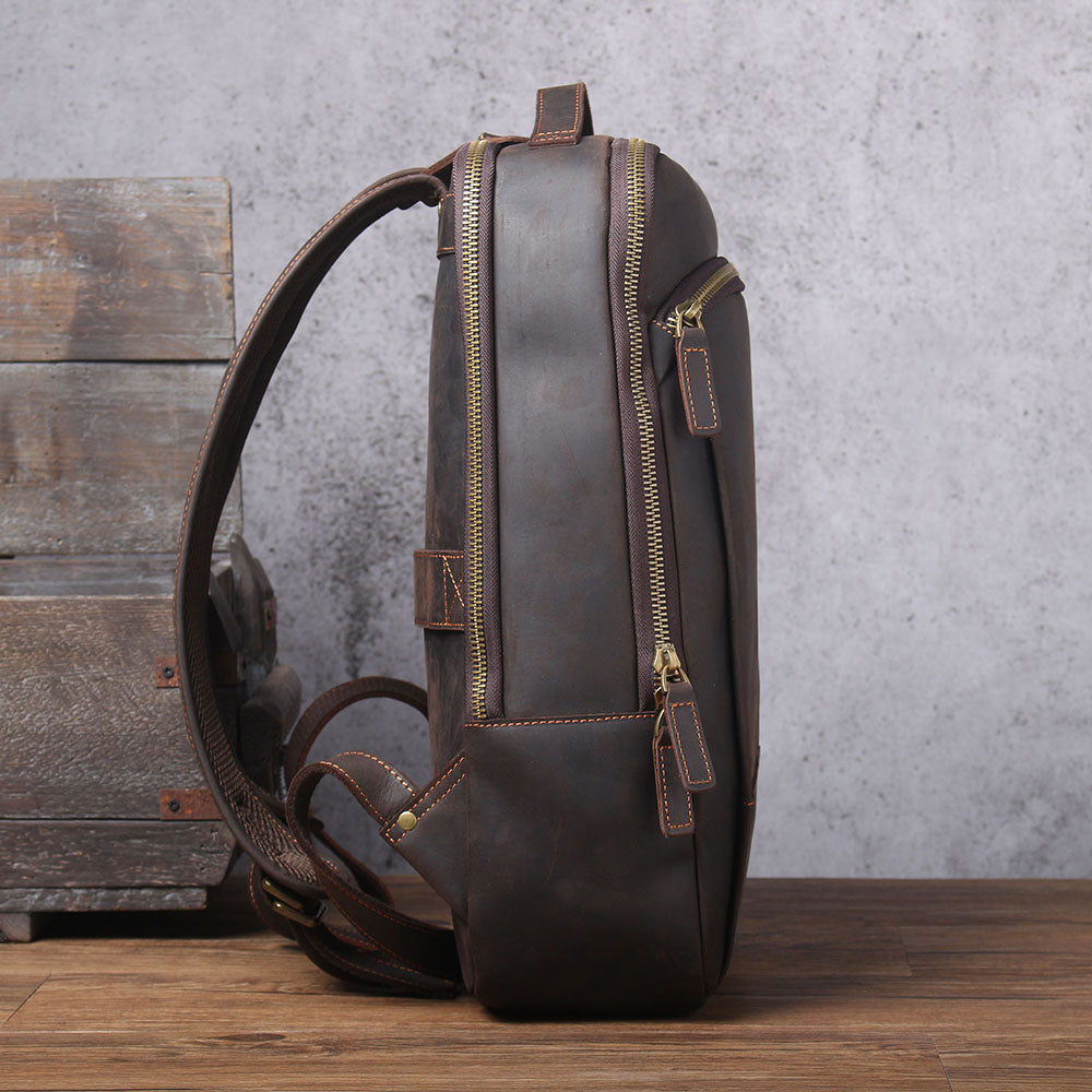 Leather Laptop Rucksack Loch Ness, stylish brown bag with zippers and shoulder straps, ideal for professionals and students.