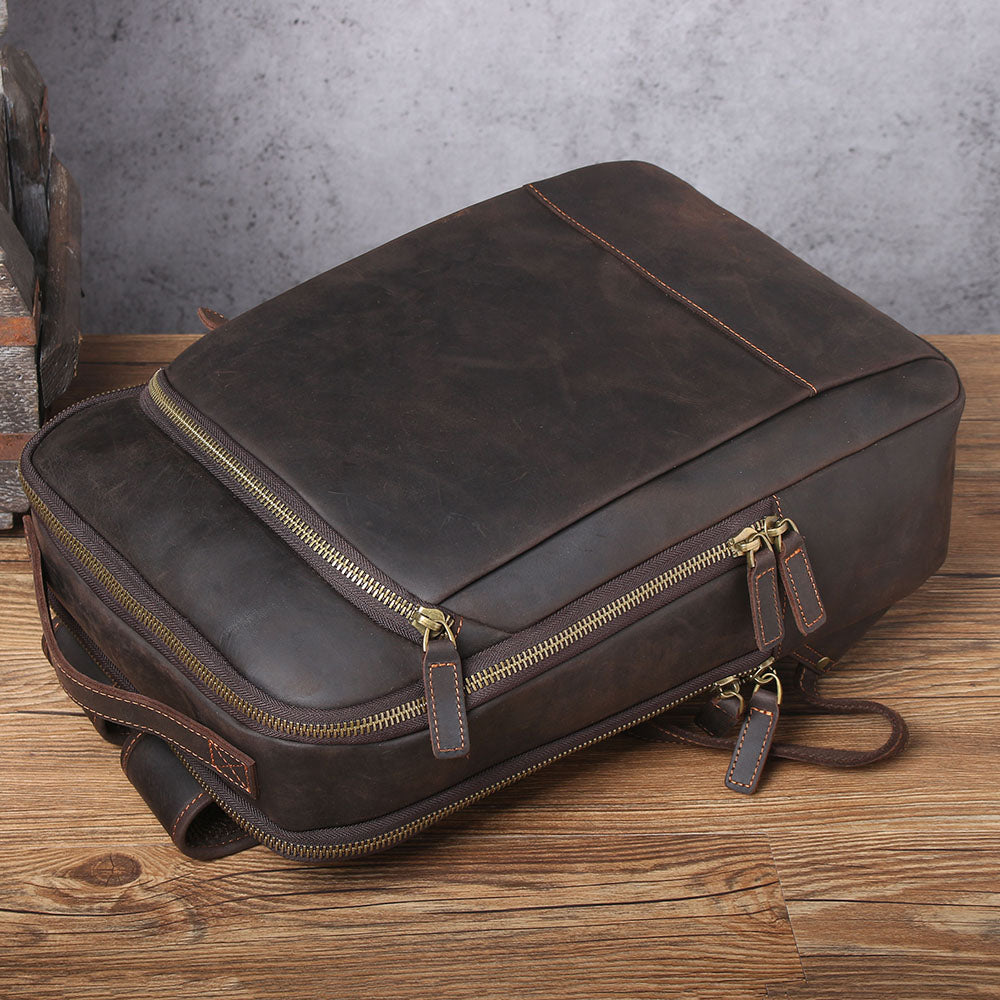 Leather Laptop Rucksack Loch Ness in dark brown leather, featuring zippered compartments and elegant design, perfect for daily use.