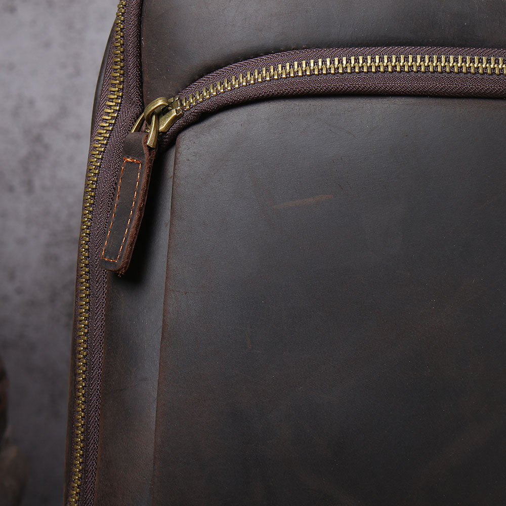 Close-up of the leather texture and zipper of the Loch Ness Leather Laptop Rucksack, showcasing its premium quality.