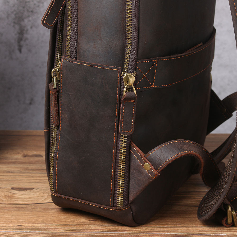Close-up of a stylish leather laptop rucksack featuring sturdy zippers and a sleek design, perfect for modern professionals.