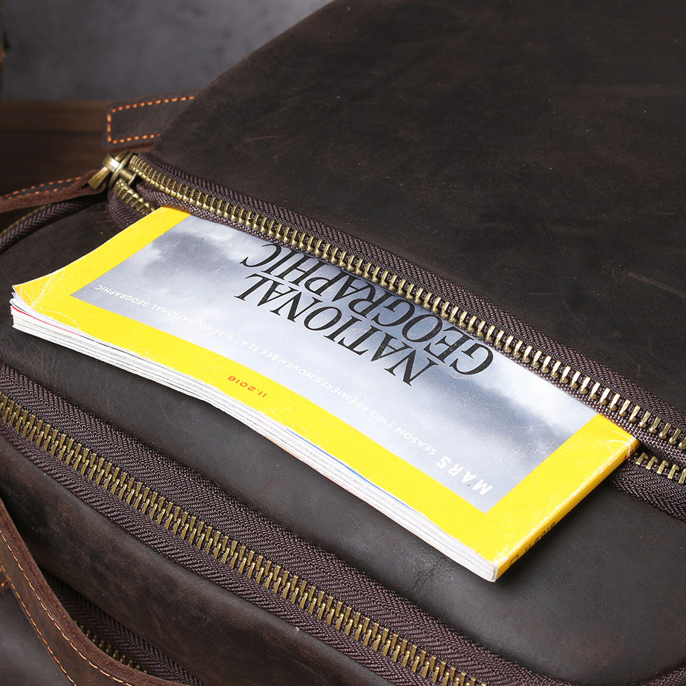 Leather Laptop Rucksack Loch Ness showing an organizer pocket with a National Geographic magazine peeking out.