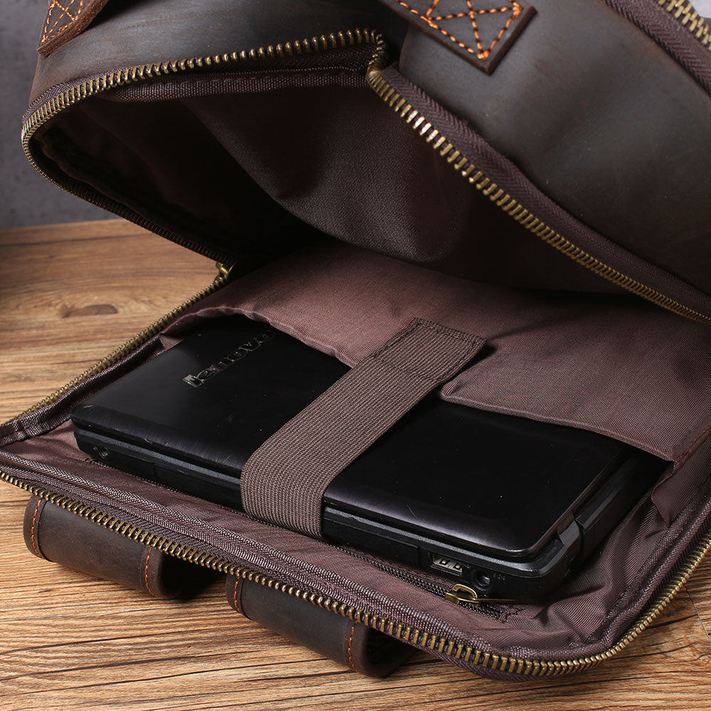 Leather laptop rucksack Loch Ness interior showing laptop secured in padded compartment.