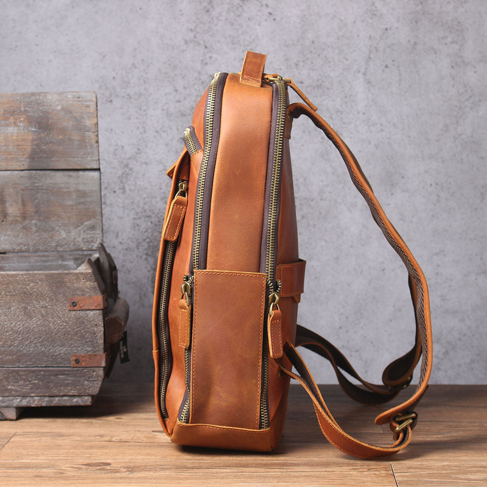 Side view of the Loch Ness leather laptop rucksack showcasing its rich brown color and practical design.
