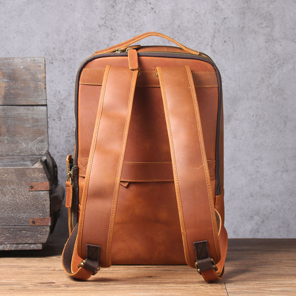 Leather Laptop Rucksack Loch Ness with adjustable straps in rich tan, showcasing a stylish and durable design.