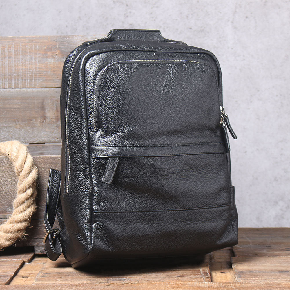 Stylish black leather bookbag from Death Valley, featuring multiple compartments and a sleek design.