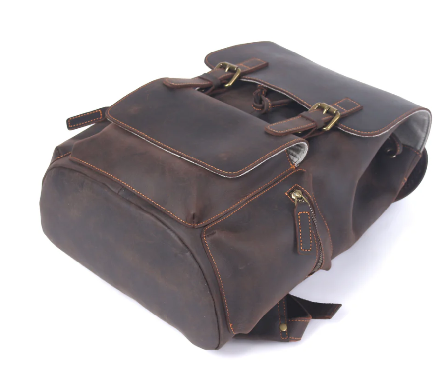 Black leather drawstring backpack with dual flap pockets and zipper, perfect for everyday use.