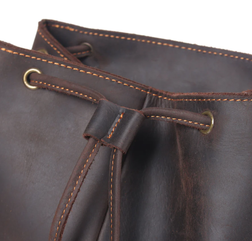 Close-up of a leather drawstring closure showcasing craftsmanship and stitching details.