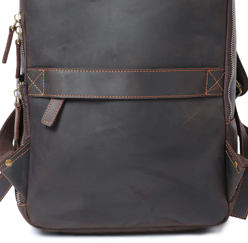Brown leather laptop rucksack from Loch Ness, featuring durable design and multiple pockets for storage.