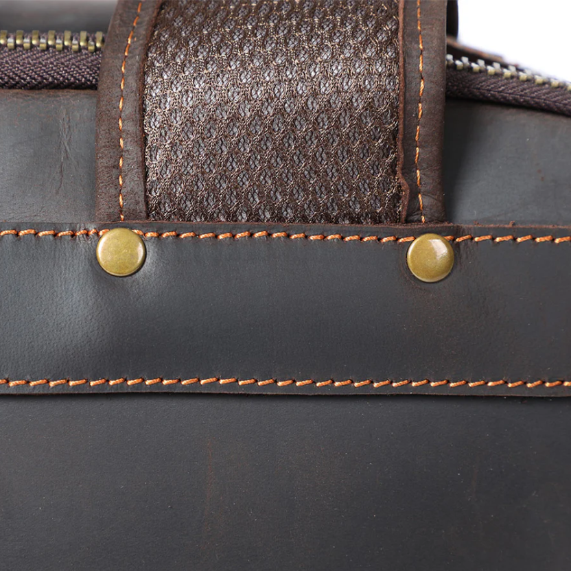 Close-up of the strap and stitching detail on the Loch Ness leather laptop rucksack.