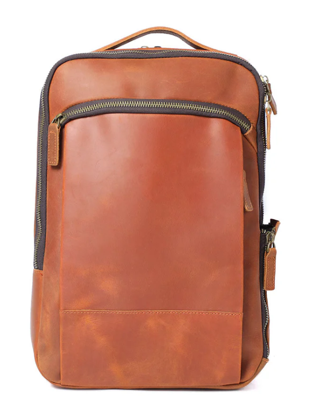 Leather laptop rucksack in rich brown color with multiple pockets and zip closure for stylish functionality.