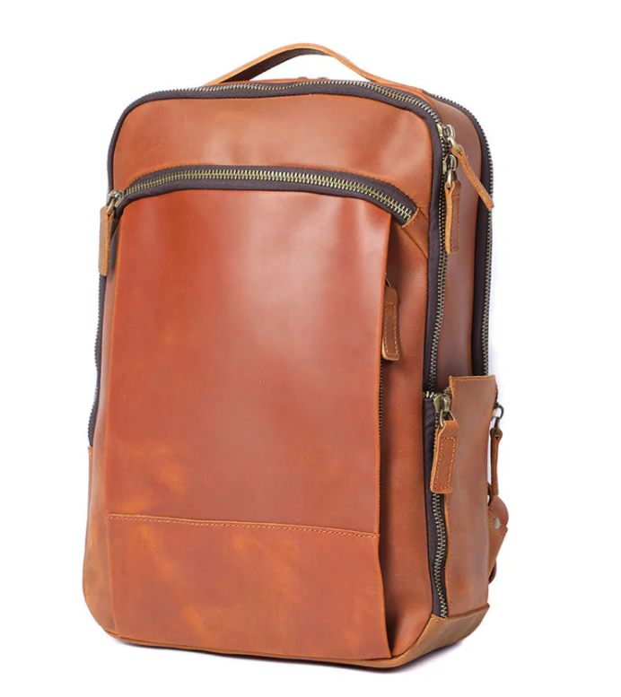 Stylish leather laptop rucksack in brown, featuring multiple pockets and a modern design for daily use.