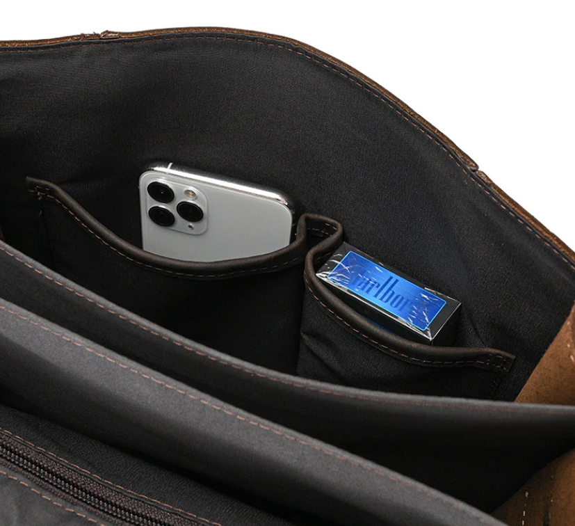 Interior view of the Leather Rucksack by Smokies, showing pockets for a smartphone and small items.